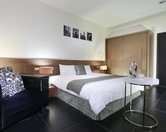 Green Life Spa Hot Spring Hotel - Jiaoxi Township - Bedroom