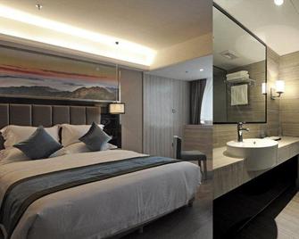 Orange Inn Wuyi Square - Yichang - Schlafzimmer