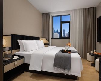 Starry Garden Hotel (Wuhan Jianghan Road Henglong Plaza Branch) - Wuhan - Bedroom