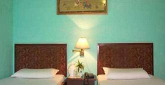 Hotel Casa Di William Khajuraho - 克久拉霍 - 臥室