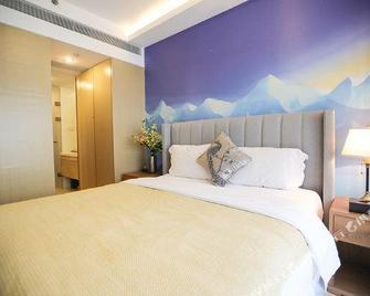 Qiyun Hotel Apartment (Qingdao Vientiane City May Fourth Square) - Qingdao - Bedroom
