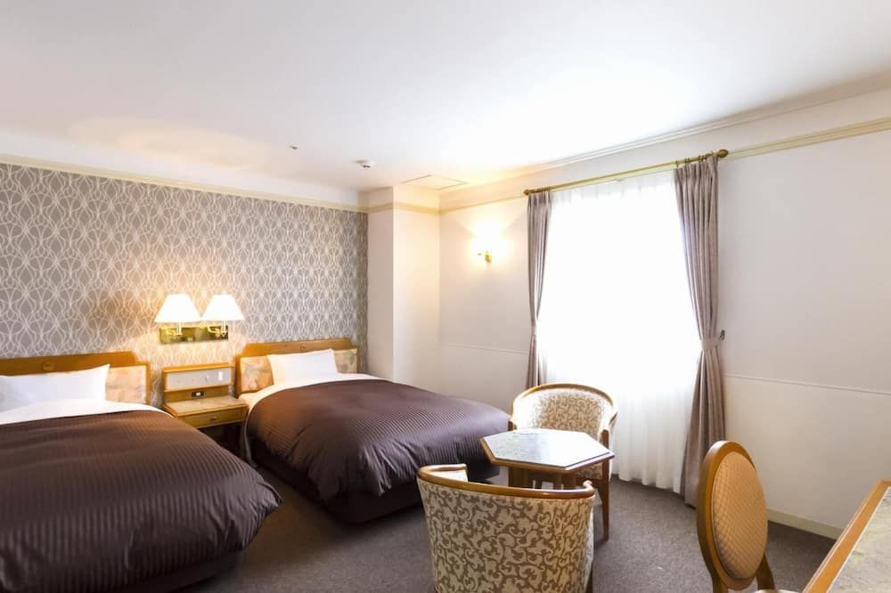 هوتل ميريجيس - ميازاكي - غرفة نوم