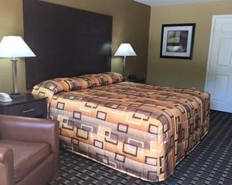 Executive Inn & Suites - Longview - Bedroom