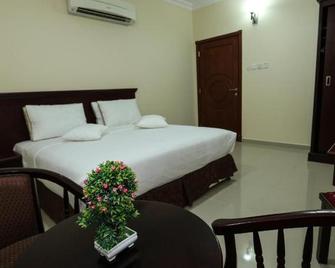 Jarzez Hotel Apartments - Seeb - Bedroom