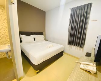 Meriton Boutique Hotel - Jakarta - Sovrum