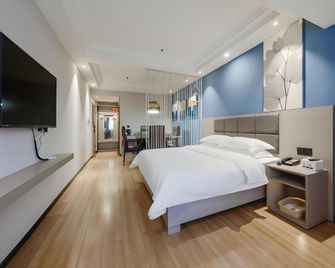 Green Tree Inn Ganzhou Zhan Wanxiang Cheng Shangwu - Ganzhou - Bedroom