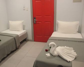 ML Suites - Cebu City - Schlafzimmer