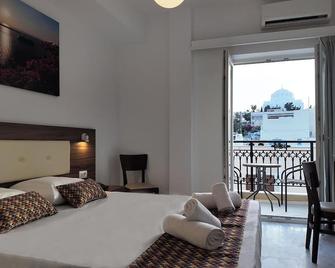 Hotel Santorini - פירה - חדר שינה