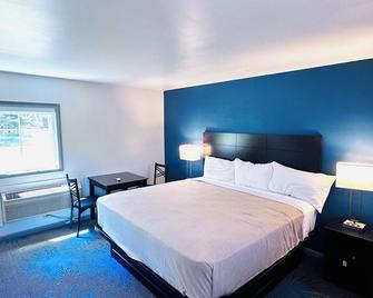 Budget Host Inn Manistique - Manistique - Bedroom