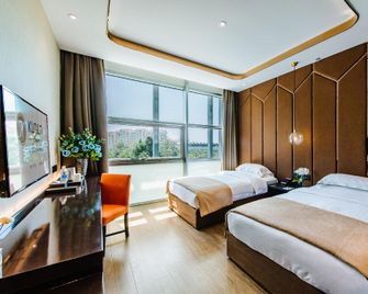 Kunlun Heyue Hotel (Qingdao Olympic Sailing Center May Fourth Square Branch) - Qingdao - Bedroom