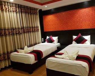 Kathmandu Regency Hotel - Kathmandu - Schlafzimmer