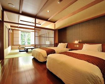 Matsunoyama Onsen Hinanoyado Chitose - Tokamachi - Ložnice