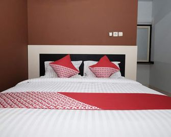 Hotel O Mars Kost Syariah - Jambi - Camera da letto