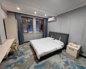Zihao Hotel (Hunchun Yifen) - Yanbian - Спальня
