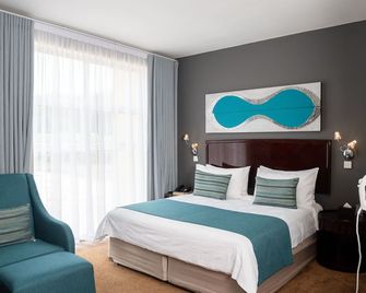 Tlotlo Hotel and Conference Center - גאבורון - חדר שינה