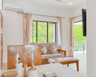 بالم هوليداي أبارتمنتس - Grand'Anse Praslin - غرفة معيشة