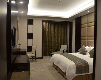 Linyi Damei Grand New Century Hotel - Linyi - Schlafzimmer
