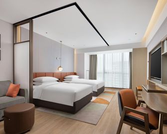 Home2 Suites by Hilton Wuhu Jiujiang - ווהו - חדר שינה