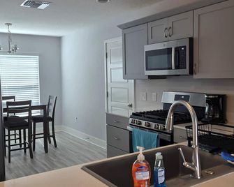 Welcome to Turtle Cove! A new 3/2 Designer Home in The Village of Well Point. - Sumterville - Kitchen