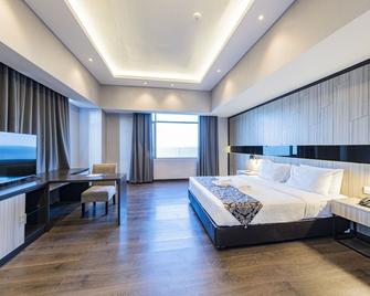 جراند جاترا هوتل بيكانبارو - بيكانبارو - غرفة نوم