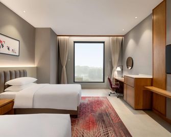 Ramada by Wyndham Ranchi Bariatu Road - Ranchi - Sypialnia