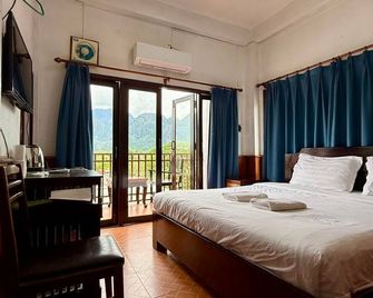 Domon Riverside Hotel - Vang Vieng - Спальня