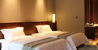 Pingtian Bandao Hotel - Chizhou - Schlafzimmer