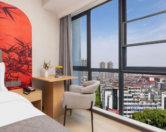 Yu Yue Lizhi Hotel (Xinxiang Sanpang Branch) - Xinxiang - Schlafzimmer
