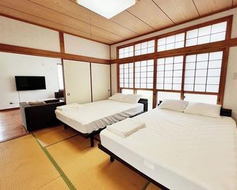 The East China Sea is right in front of you A spacious ocean view rental villa for up to 20 people / Oshima-gun Kagoshima - Yamato - Bedroom