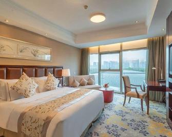 Juna Hubin Hotel - Wuxi - Bedroom