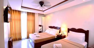 Ipil Suites Puerto Princesa - Puerto Princesa - Yatak Odası