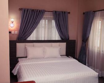 Mo-House Hotel and Event Center - Bwari - Habitación
