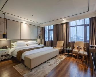 Nanyang Lanting Hotel - Nanyang - Schlafzimmer