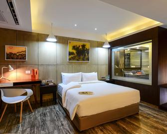 Howard Johnson by Wyndham Kolkata - כלכולתה - חדר שינה