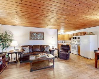 Dog-friendly, lake-view condo with pool, hot tub & nearby beach - near parks - Whitefish - Living room