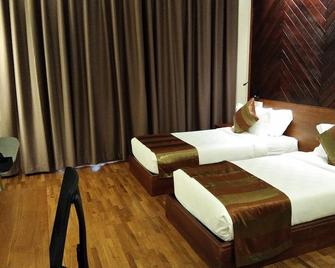 Woodies Bleisure Hotel - Kozhikode - Habitación