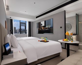 Suisse Place Apartment Hotel Wuhu Zhongshan Road Pedestrian Street - Wuhu - Makuuhuone