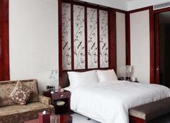Tai Zhou International Jinling Hotel - Taizhou - Slaapkamer