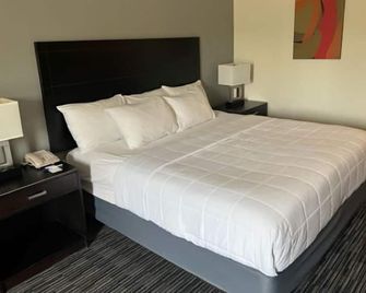 American Inn And Suites Houghton Lake - Houghton Lake - Ložnice