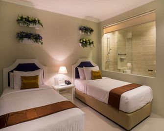 Amalfi Hotel Seminyak - דנפסאר - חדר שינה