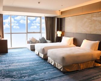 Grand Metropark Hotel Nantong - Nantong - Schlafzimmer
