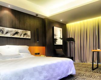 Zhangjiajie Baway Fashion Hotel - ג'אנגג'יאיי - חדר שינה