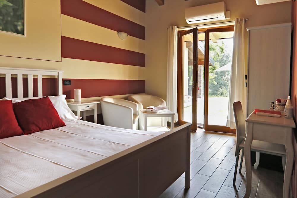 أجريتوريسمو تيرا إي لاجو دي إسيو - باراتيكو - غرفة نوم