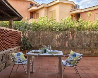 D4 - D2 by Interhome - Golfo Aranci - Patio