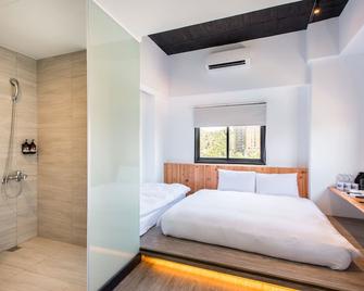Traveller Inn TieHua Cultural and Creative Hotel - Taitung - Schlafzimmer