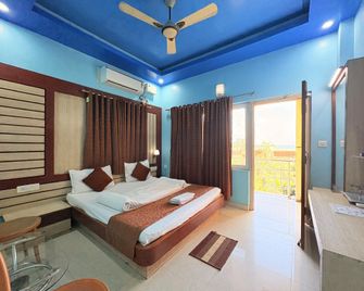 Hotel Swarna Villa puri - Puri - Slaapkamer