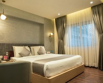 Hotel Pan Asia Continental - Kolkata - Schlafzimmer