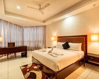 The Bentley Seaside Boutique Hotel - Chennai - Schlafzimmer