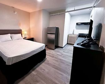 Studio City Suites, a Travelodge by Wyndham - Texarkana - Slaapkamer