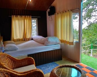 The Cocoon Camps & nature Resorts - Pangot - Bedroom